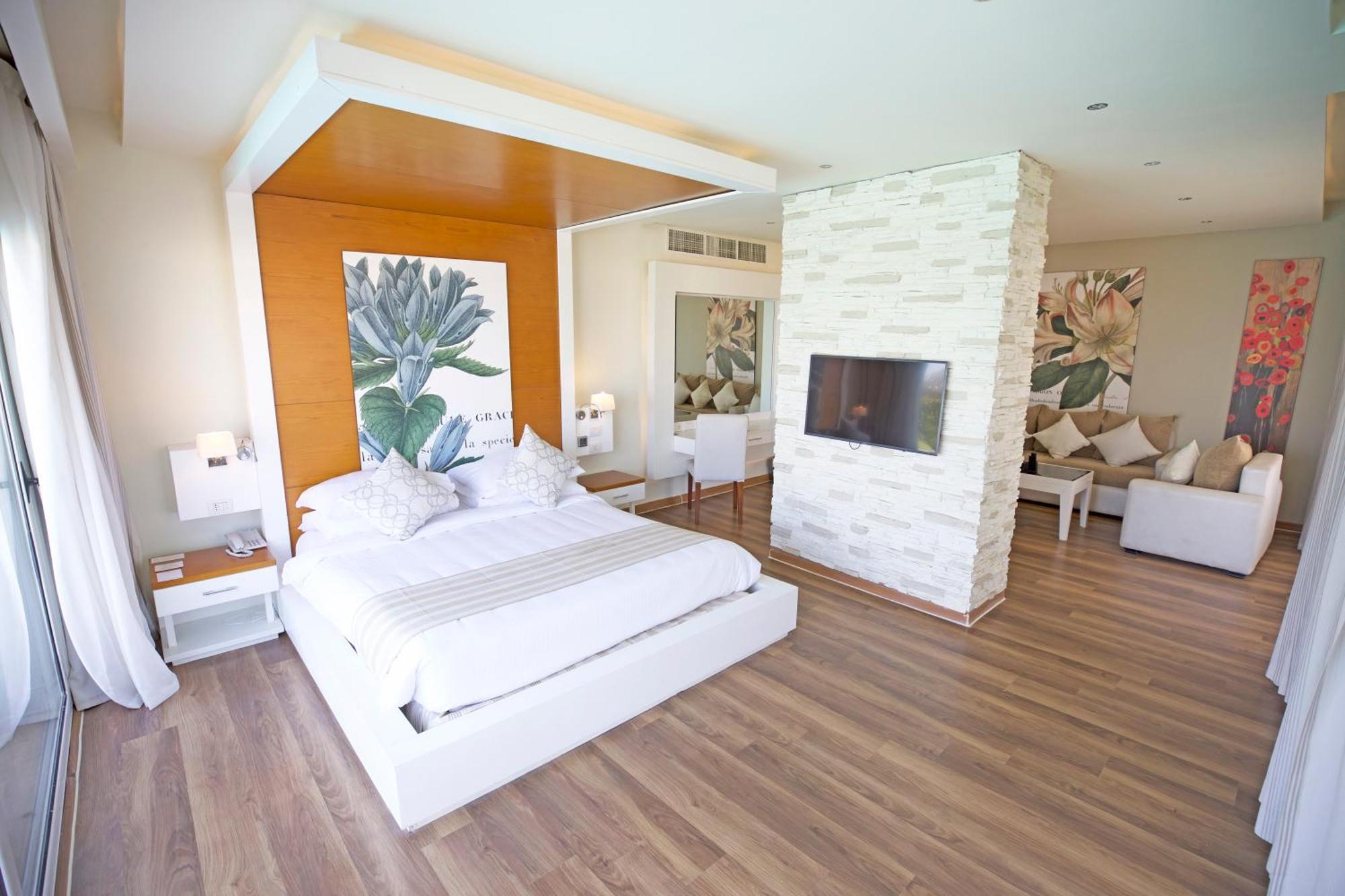 Sunrise Montemare Resort -Grand Select (Adults Only) Sharm el-Sheikh Bilik gambar A bedroom at the hotel